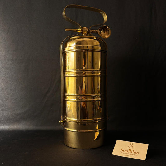 Gold vintage-style fire extinguisher on a black background with 'Soulbliss' brand card.