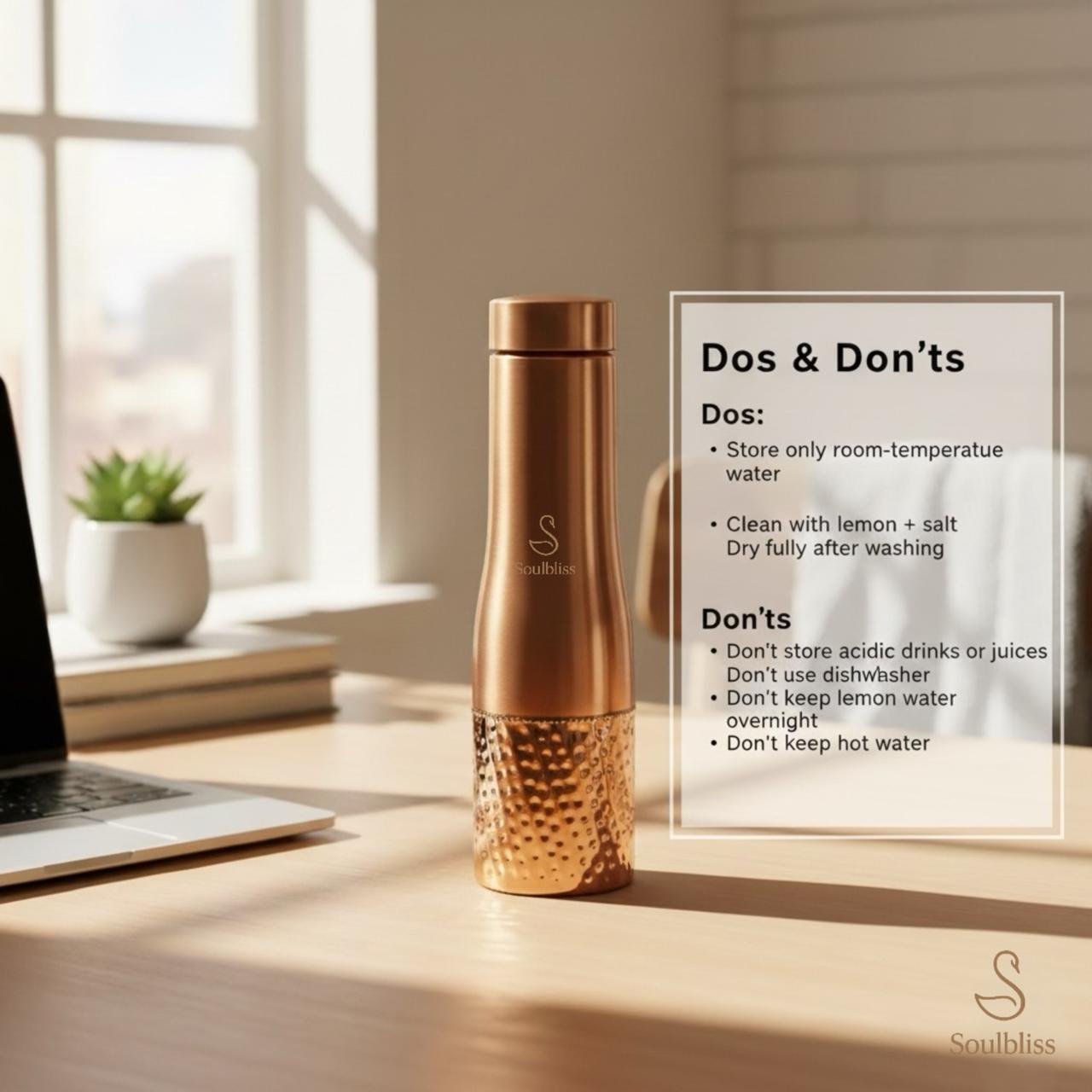 Copper-colored water bottle on a desk with sunlight streaming through a window