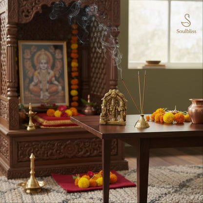 Pooja room with wooden altar, deity idol, and decorative elements. ram darbar idol brass 