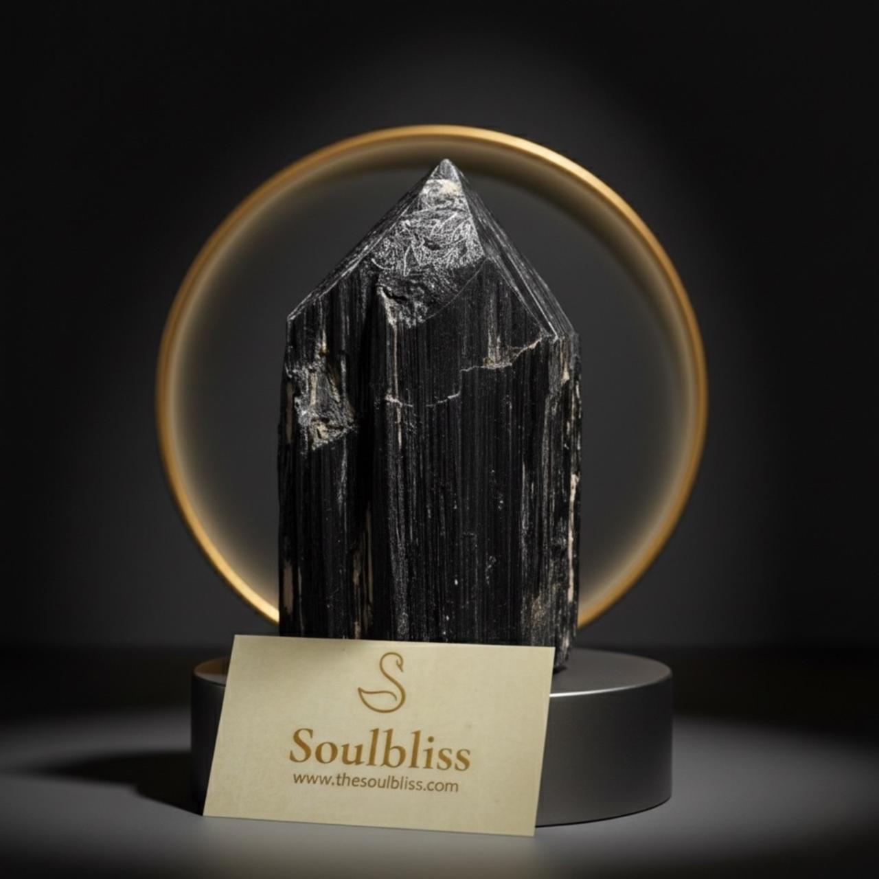 Crystal tower on a stand with 'Soulbliss' card in the foreground against a dark background